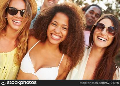 Group Of Young Friends Having Party On Beach Together