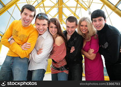 group of young friends on footbridge look on you