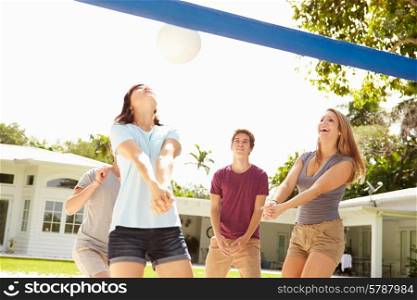 Group Of Young Friends Playing Volleyball Match