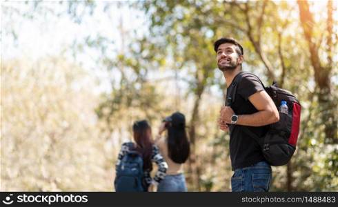 Group of young friends traveler in nature. Happy Bearded Man backpacker on vacation. Copy space.