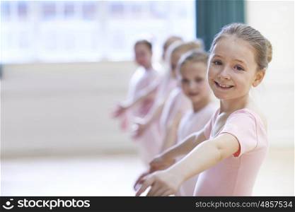 Group Of Young Girls In Ballet Dancing Class