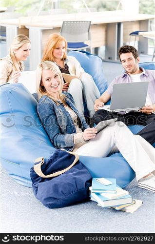 Group of young high-school or university students learning and relaxing