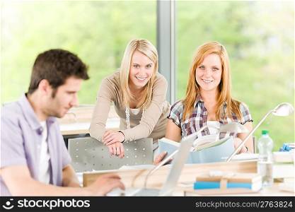 Group of young high school students learning relaxing with books