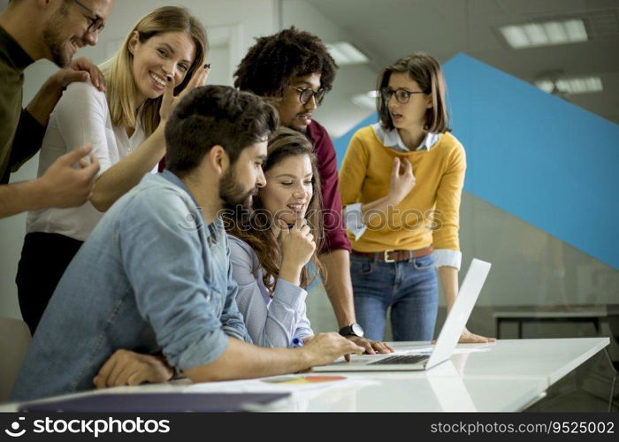 Group of young multiethnic business people working and communicating together in the creative office