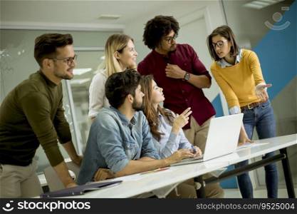 Group of young multiethnic business people working and communicating together in the creative office