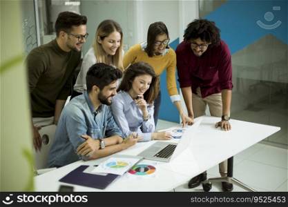 Group of young multiethnic business people working and communicating together in the creative office