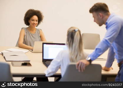 Group of young multiracial people working in the modern office