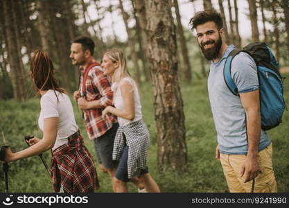 Group of young people are hiking in mountain at spring day