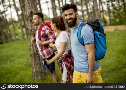 Group of young people are hiking in mountain at spring day