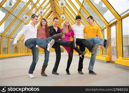group of young people dance cancanon footbridge