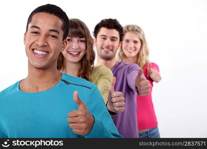 Group of young people giving the thumbs-up