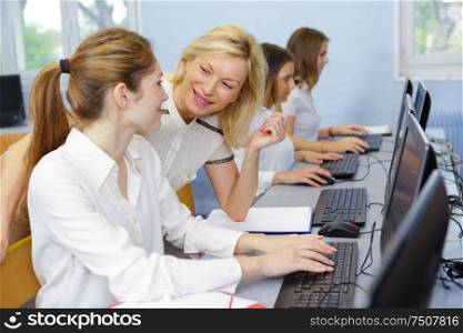 group of young people in a business school classroom