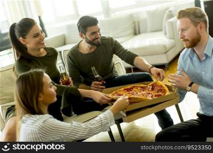 Group of young people on the  pizza party in the room