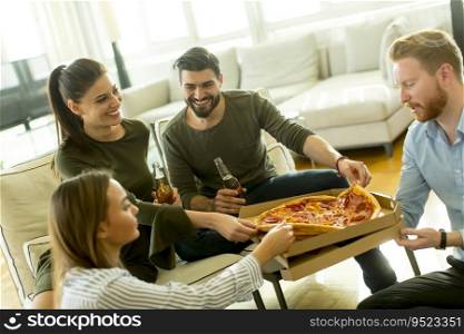 Group of young people on the  pizza party in the room