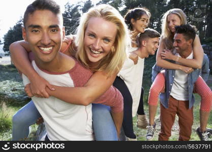 Group Of Young People Relaxing In Countryside