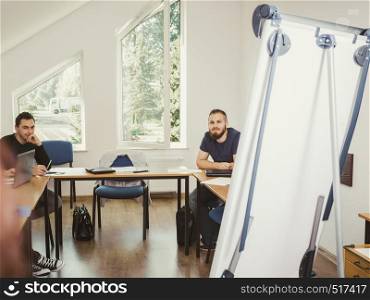 Group of young people sitting in class planning concept, studying together creating new startup enjoying their work time.. Group of students in class