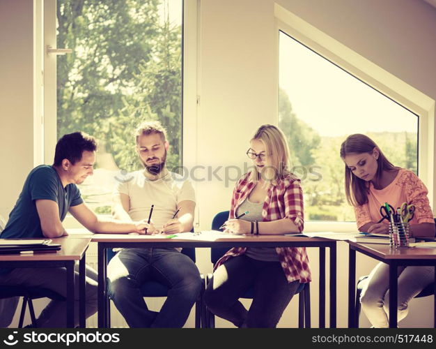 Group of young people sitting in class planning concept, studying together creating new startup enjoying their work time.. Group of students in class