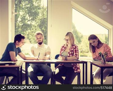 Group of young people sitting in class planning concept, studying together creating new startup enjoying their work time.. Group of students in class