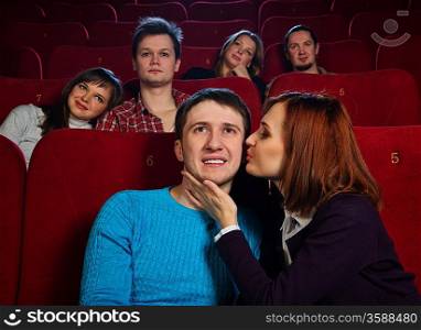 Group of young people watching movie in cinema