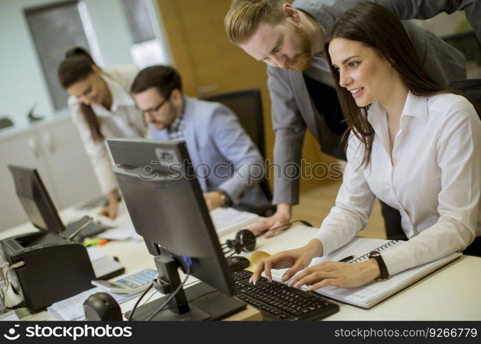 Group of young people working in the modern office