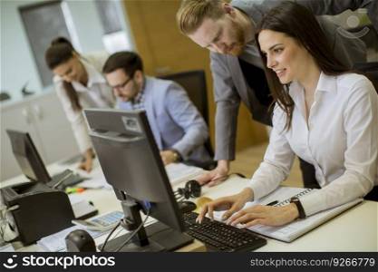 Group of young people working in the modern office