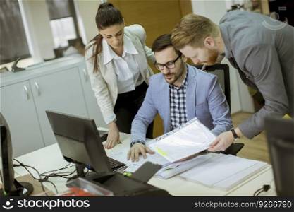 Group of young people working in the modern office