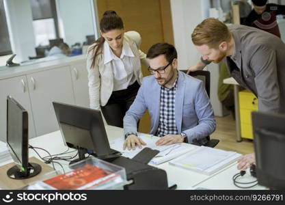 Group of young people working in the modern office