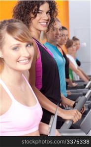 Group of young woman in the gym centre; working out.