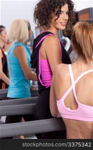 Group of young woman in the gym centre; working out.