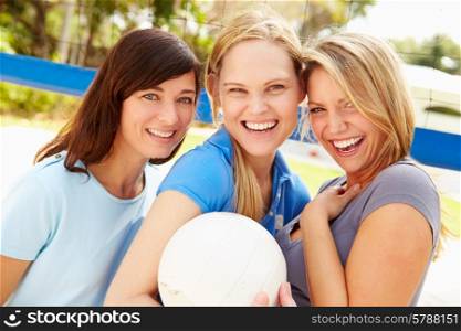 Group Of Young Women Playing Volleyball Match