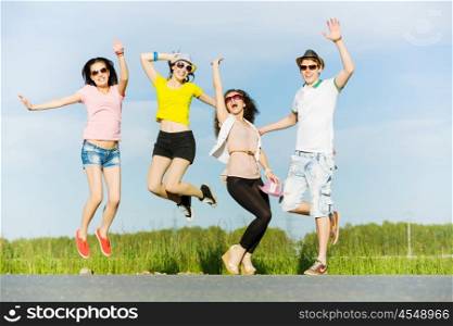 Group of youths. Young happy people having fun outside in summer