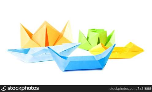Group origami figure of boats (isolated on white)