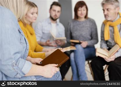 group people reading books therapy session 3