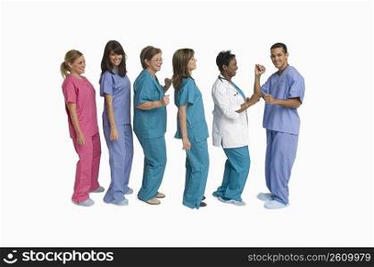 Group portrait of doctors and nurses dancing