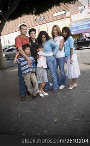 Group portrait of family on downtown Los Angeles district, California