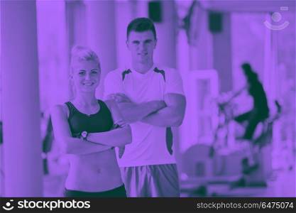 group portrait of healthy and fit young people in fitness gym duo tone. people group in fitness gym