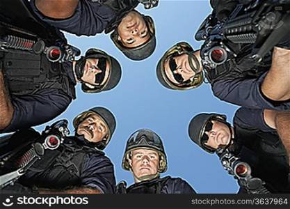 Group portrait of Swat officers standing in circle