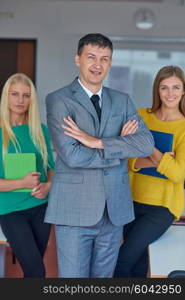 group portrait of teacher with students in shcool classrom