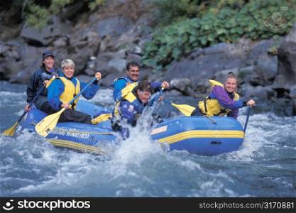 Group Rafting Trip On A Mountain River