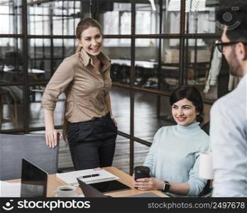 group smiley businesspeople during meeting indoors