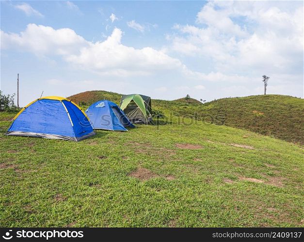 Group tents camping on mountain peak in the tropical forest at Tak Province, Thailand.