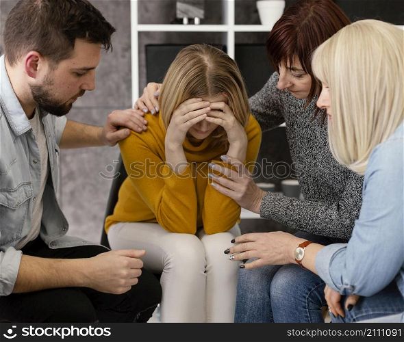 group therapy comforting woman