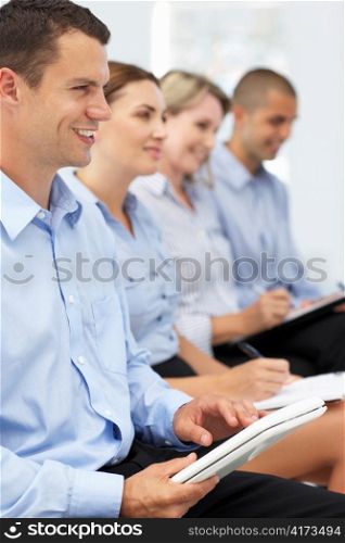 Group watching business presentation
