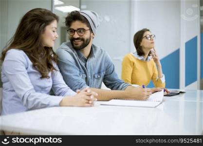 Group young coworkers together discussing creative project during work process