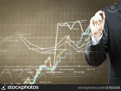 Growing graph. Businessman hand drawing business graphs on media screen