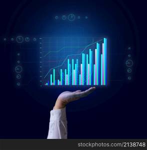 growing graph on a holographic grid and a man&rsquo;s hand. Business performance growth, high profitability, success
