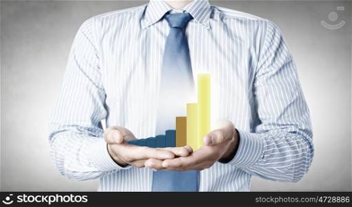 Growing income. Close up of businessman holding increasing graph in palm