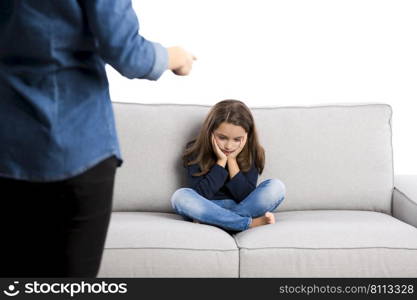 Grown up rebuking a little child for bad behavior