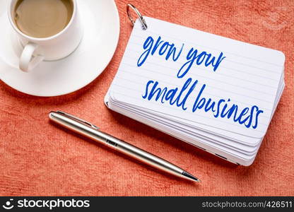 grown your small business - reminder or advice on a stack of index cards with a cup of coffee