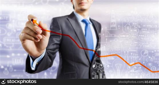 Growth concept. Close up of businessman drawing increasing graph with marker